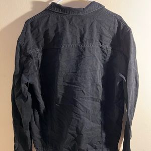 Black denim jacket with silver buttons